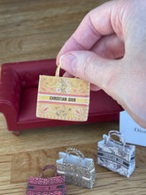 Cargar imagen en el visor de la galería, Dollshouse Miniature Dior book bag 1:12th scale
